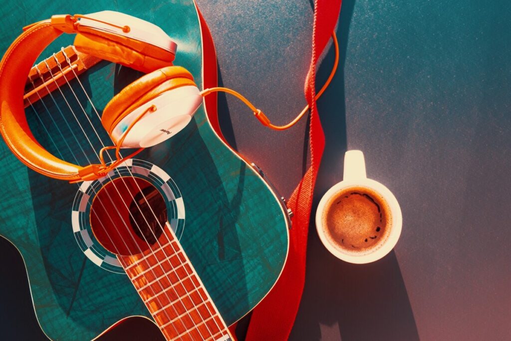 image of guitar and cup of coffee