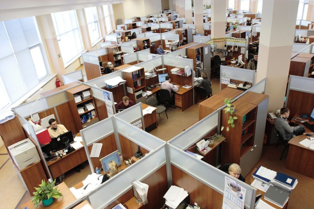 Office environment with people working in cubicles