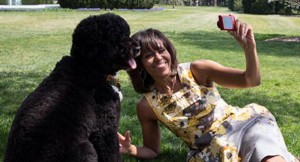 Michelle Obama taking a selfie with Bo, 2013