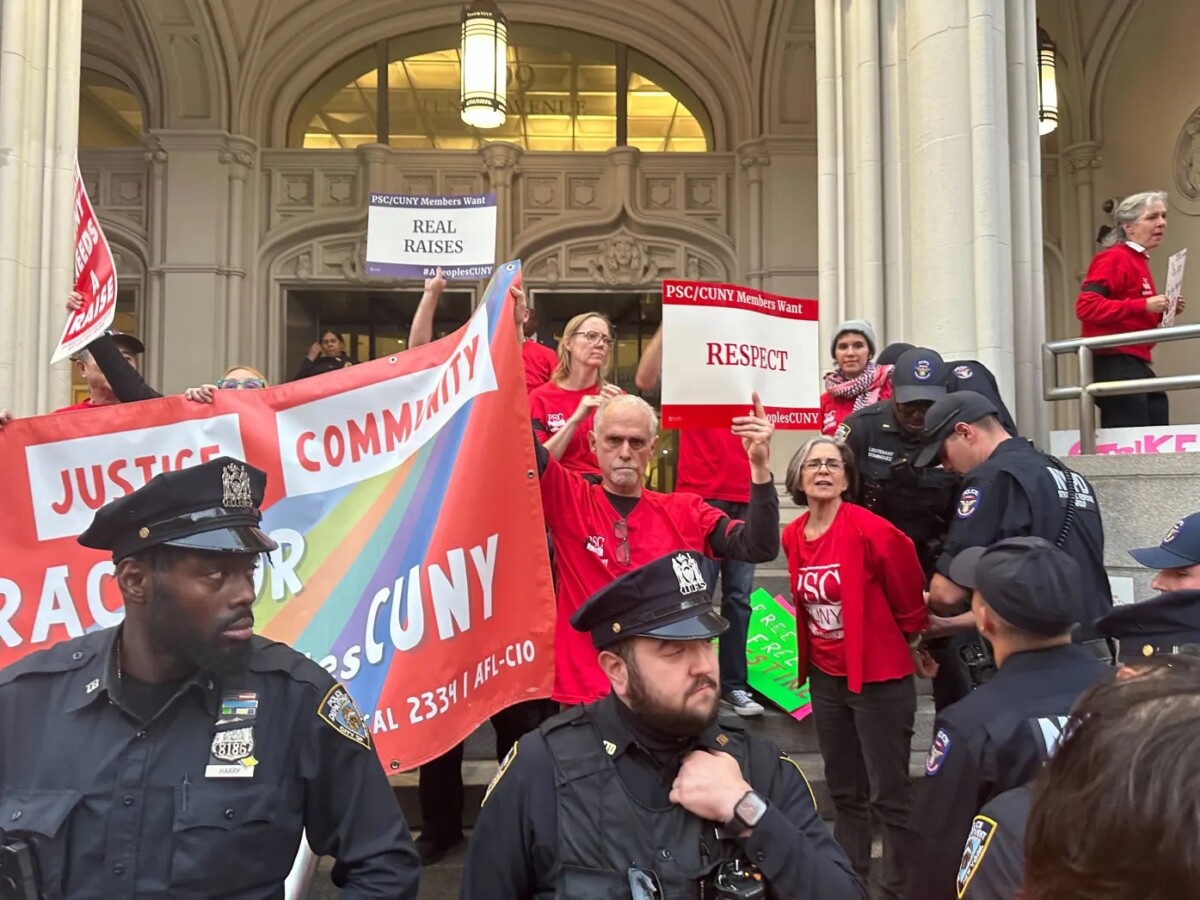 Photograph of police and CUNY faculty and staff at a protest on the steps of John Jay College