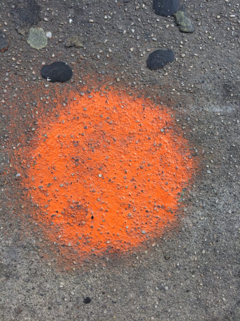 orange spot on sidewalk