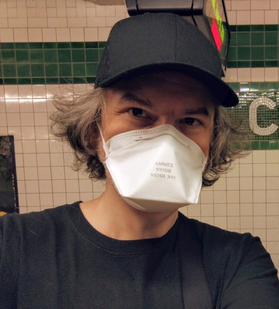 Prof. Ellis wearing a mask before getting on a subway train.
