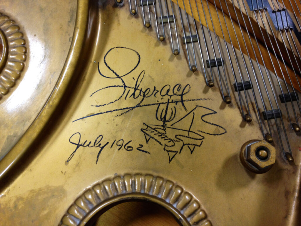 Liberace's autograph on a piano in Atlanta, Georgia.