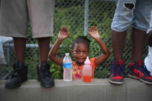 Scott Olson, Gabrielle Walker, 5, protests the killing of Michael Brown, August 17, 2014