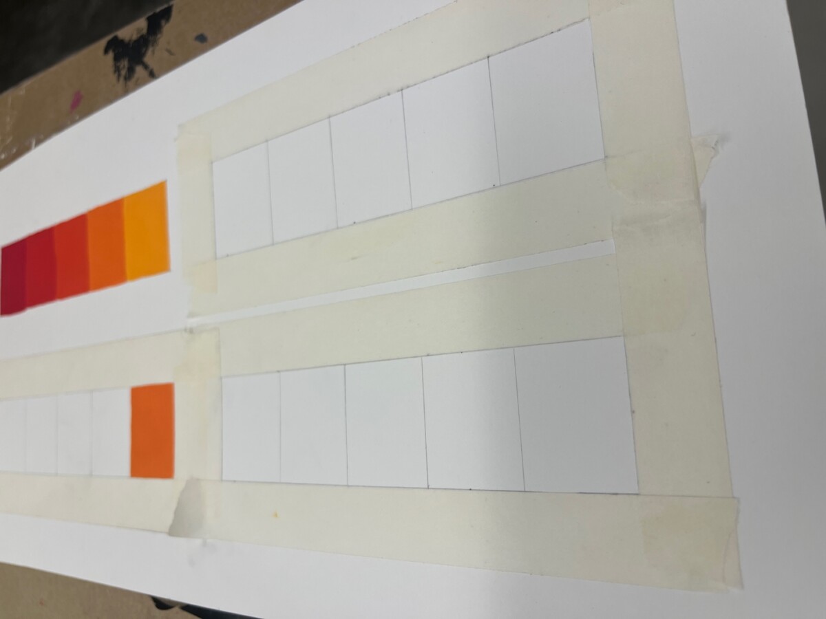 A white board with orange and white squaresDescription automatically generated