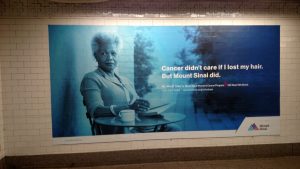 A photograph taken in the 42nd Street subway. Image of a women who found excellent cancer treatment at Mount Sinai Hospital.