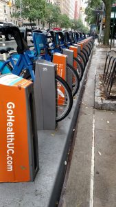 This photo was shot in New York City and captures a row of city bikes that have been branded with Northwell's urgent care "GoHealthUC.com." It demonstrates how every commercial space can be branded and how area healthcare organizations make their expanding services known.