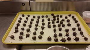 Team D: Tiphanique, Victoria and Joon dipped hazelnut marzipan into dark chocolate.