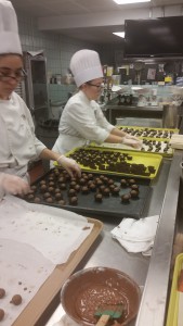 Sofia and Victoria packaging the chocolates
