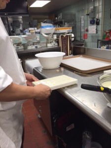 Joon making sure all the air bubbles are out of the mold for the Cinnamon Truffles. 