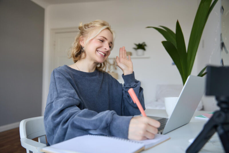 Girl smiling to laptop camera