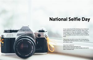 A camera by the window with a description on what National Selfie Day is about