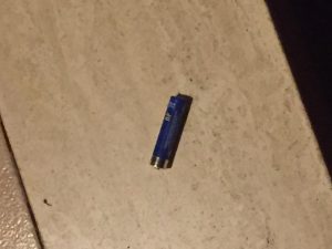 This image is a battery. It was found at my orthodontist's stairs .It is a geometric shape because you can tell what it is.