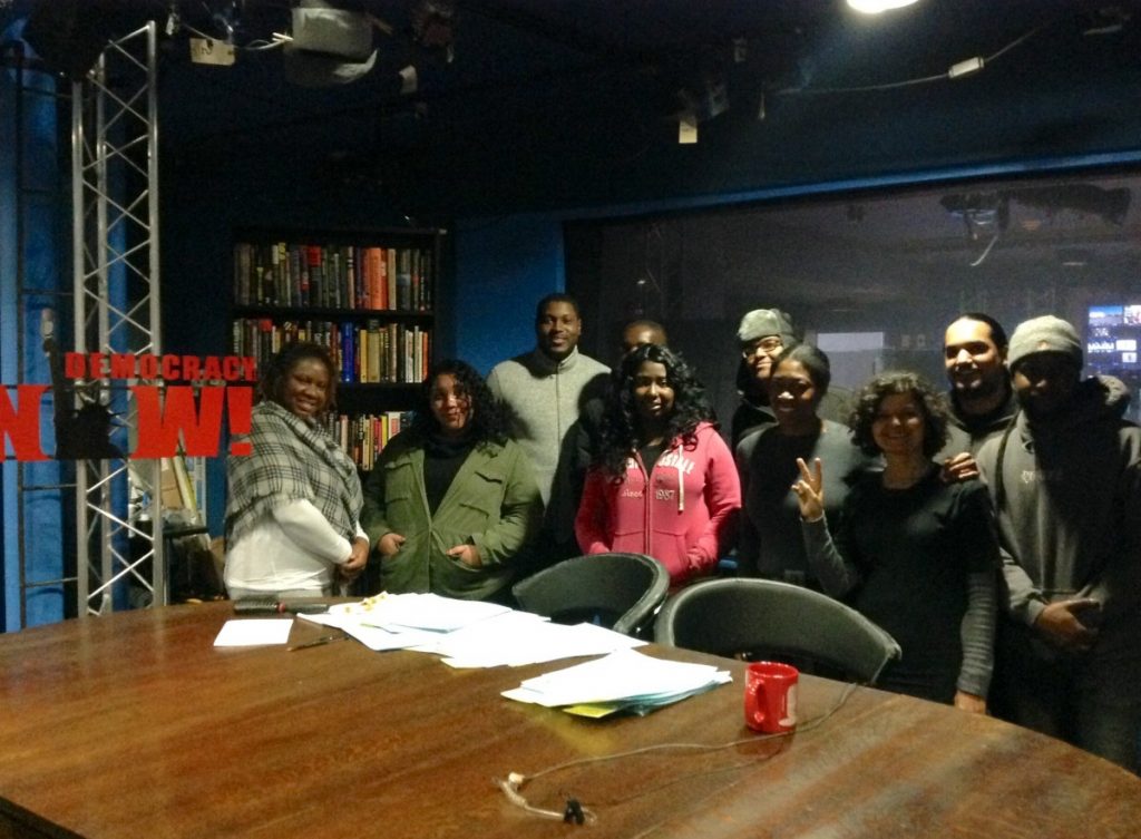 A group shot of students visiting Democracy Now! studios.