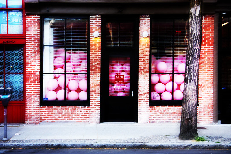 pink balloons filling a storefront's windows