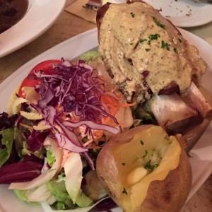 Traditional Belgian dish ( Ham Hock with baked potato and salad) 