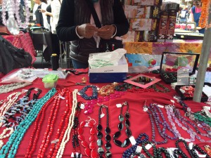 A woman making more of her special handmade jewelry. They go for 15€ and up. 