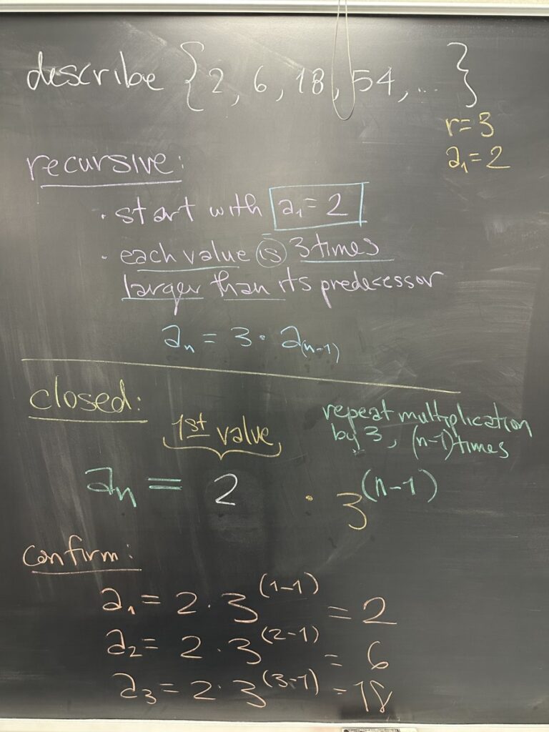 A photo of math written on a blackboard.