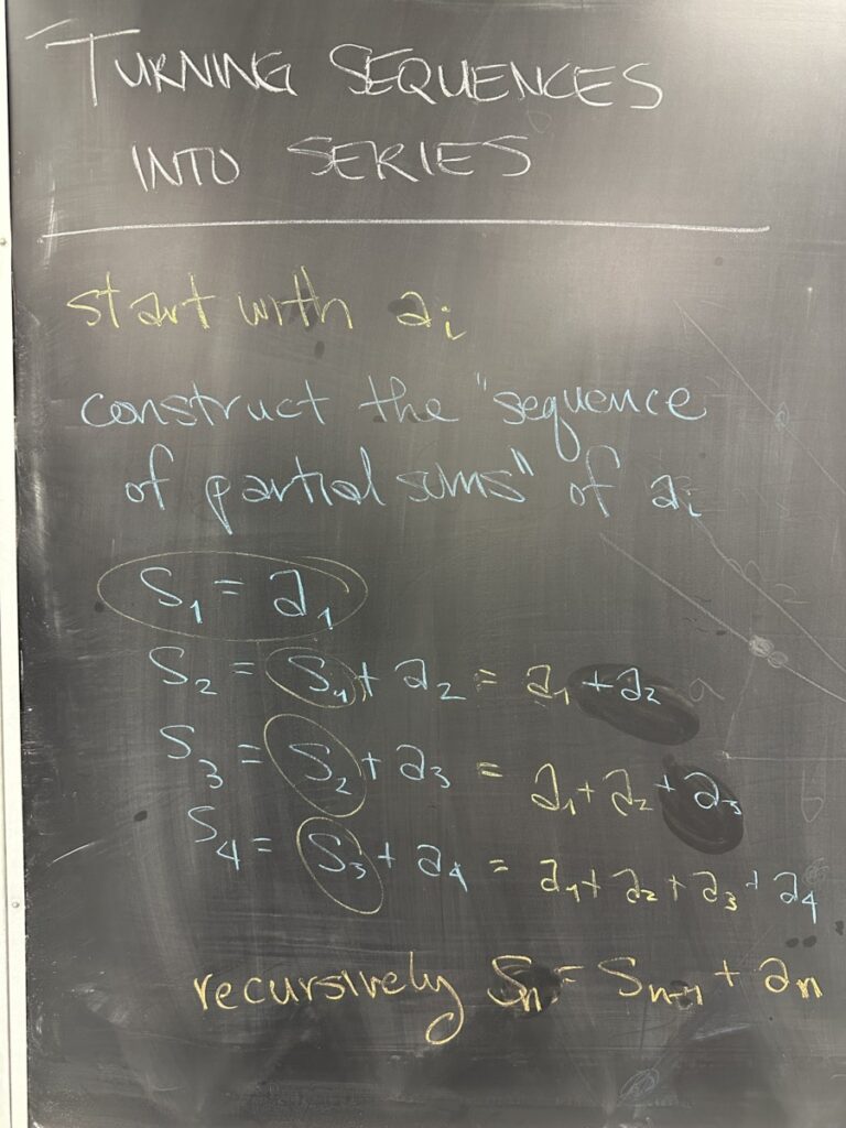 A photo of math written on a chalkboard.