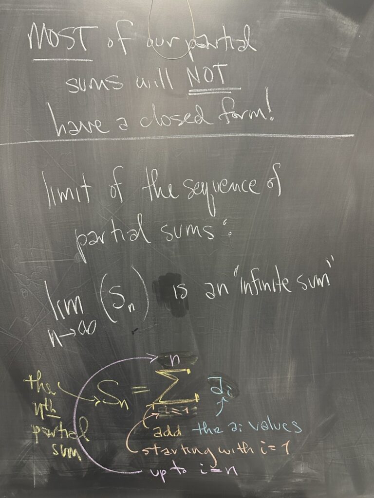 A photo of math written on a chalkboard.