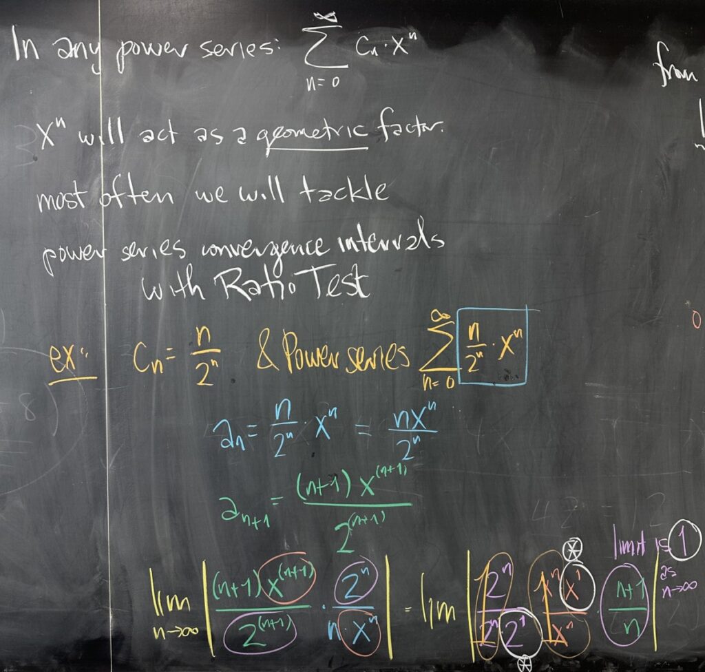 A photo of math course notes written on a blackboard.