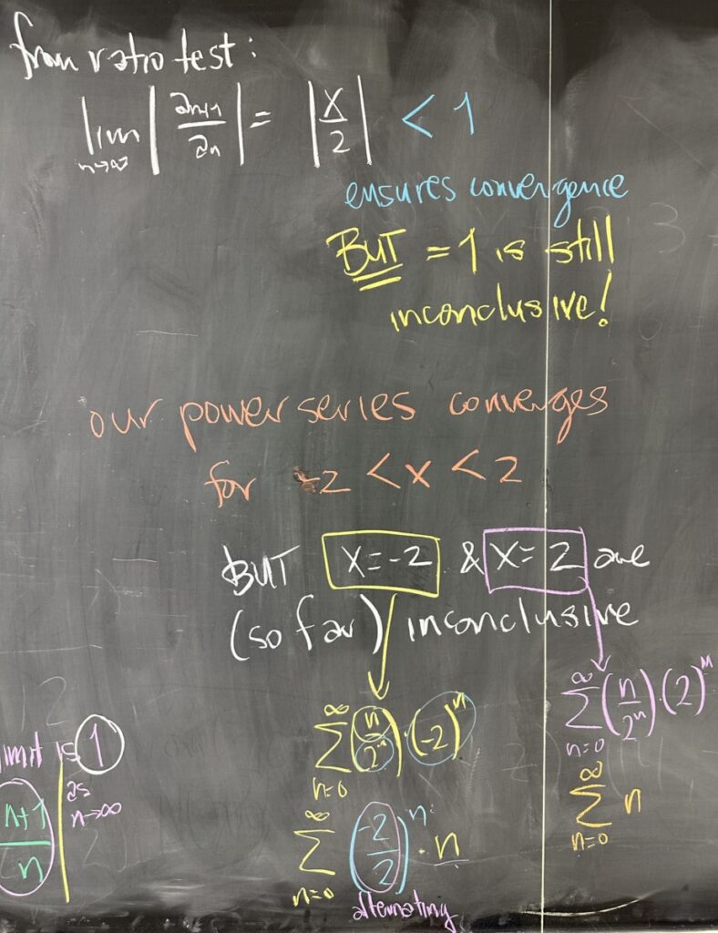 A photo of math course notes written on a blackboard.