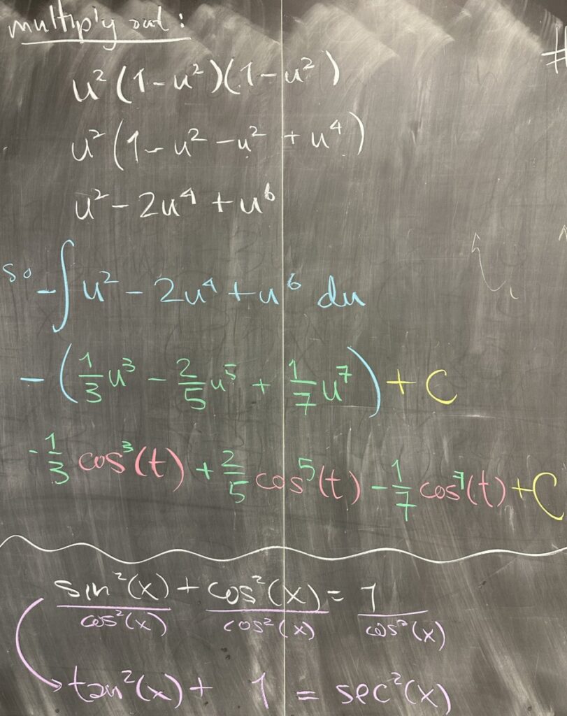 A photo of math course notes written on a blackboard.