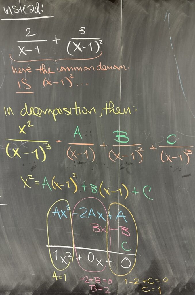 A photo of math course notes written on a blackboard.