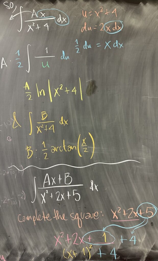 A photo of math course notes written on a blackboard.