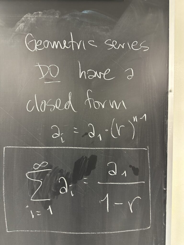 A photo of math written on a chalkboard.