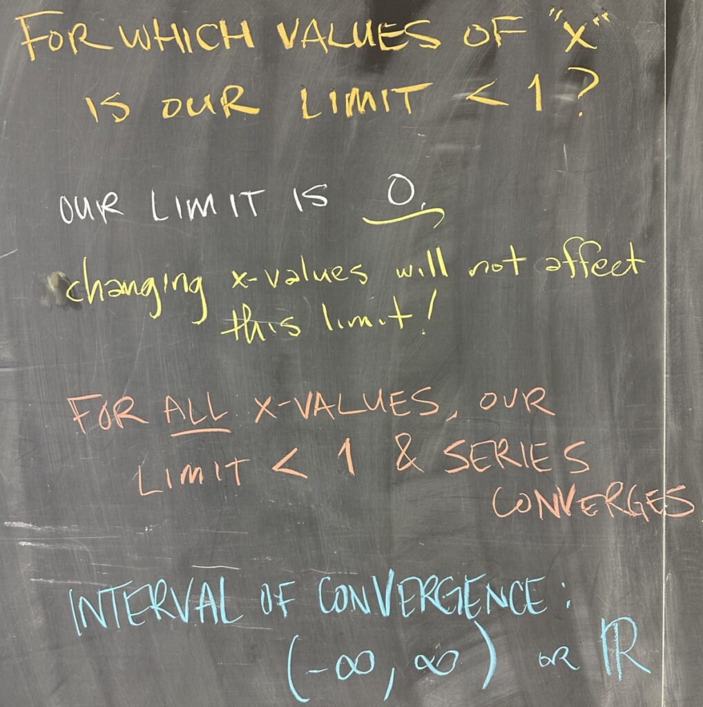 A photo of math notes written on a chalkboard.