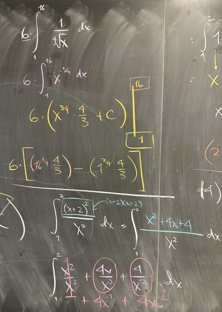 A photo of math course notes written on a blackboard.