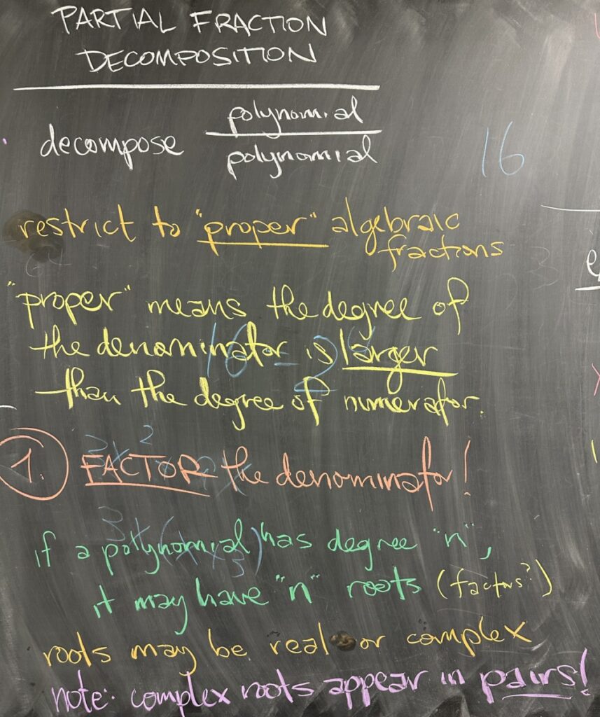 A photo of math course notes written on a chalkboard.