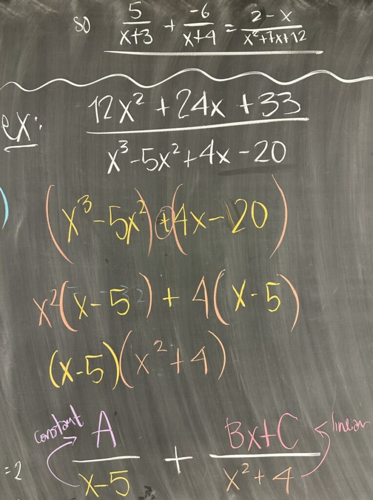 A photo of math course notes written on a chalkboard.