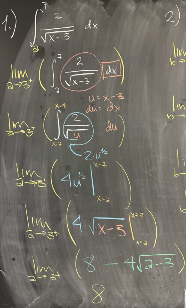 A photo of math course notes written on a blackboard.