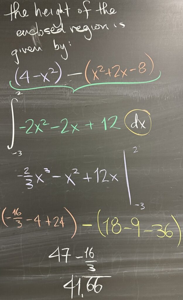 A photo of math course notes written on a blackboard.