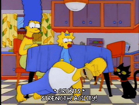 Animated gif of Homer Simpson doing one-arm pushups in the kitchen with Maggie on his back, grunting and saying "Strength! Agility!"