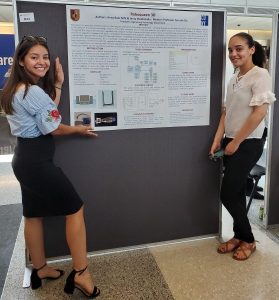 Jensy and Anny posing next to their poster at the CRSP Annual Poster Presentation