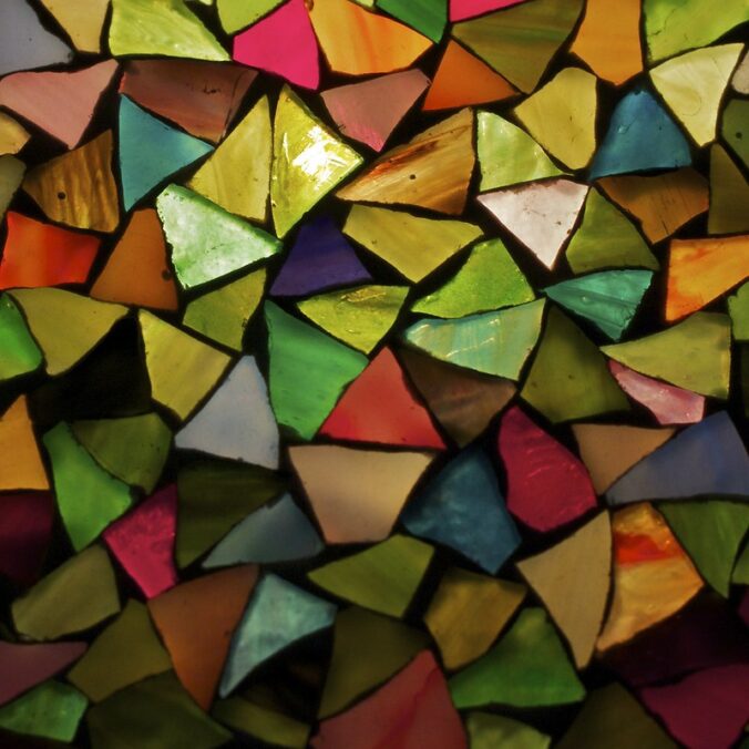 Triangular pieces of colorful shiny material clustered together