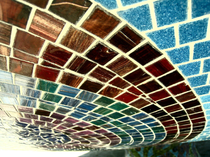 different colored square tiles in a swirl pattern