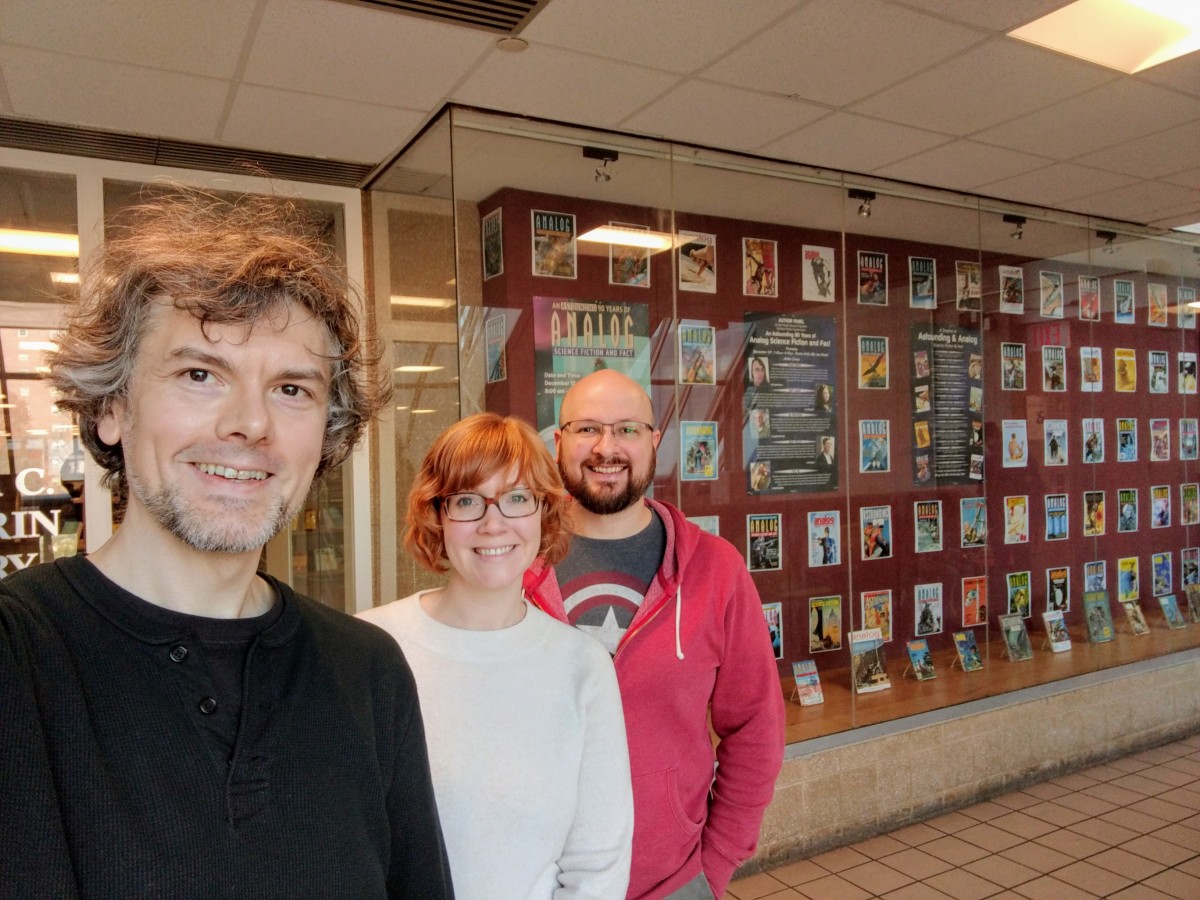 L to R: Jason Ellis, Emily Hockaday, and Trevor Quachri in front of the Library's large display case.