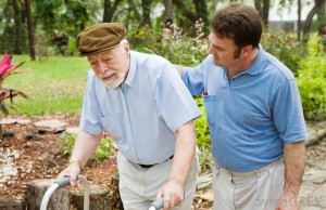 man-helping-elderly-man-walk