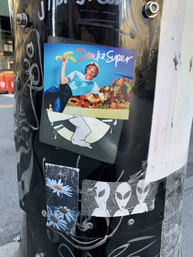 Photograph of sticker on lamp post.