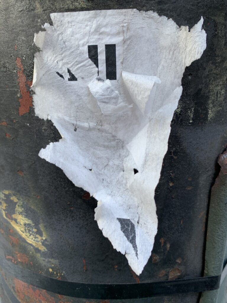 Photograph of sticker on lamp post.