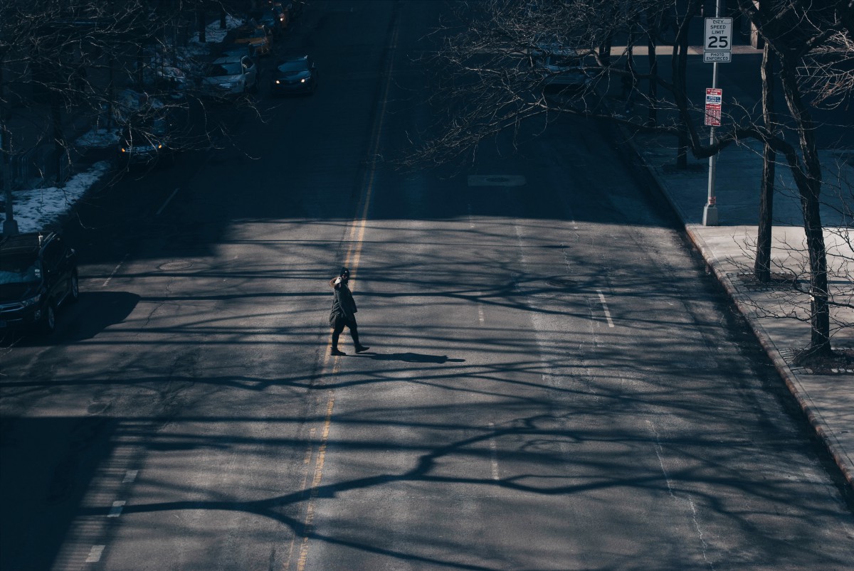 a person walking across a street