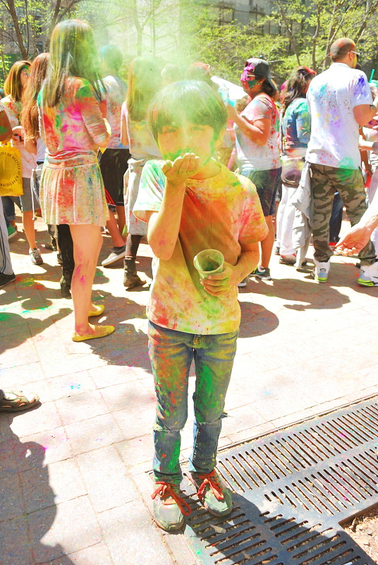 a boy covered in colors