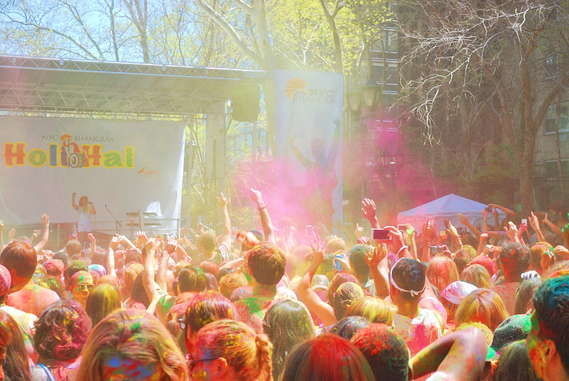 a crowd covered in colors