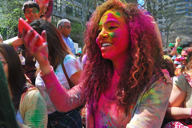 a young woman covered in colors