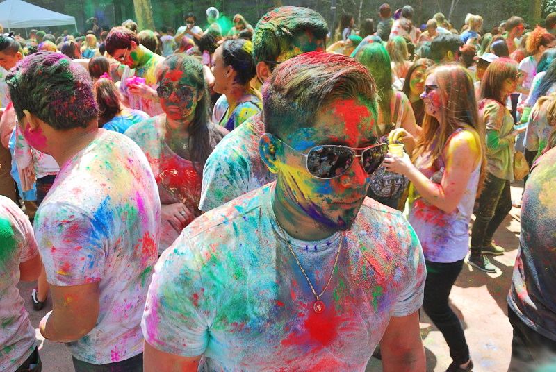 a young man covered in colors