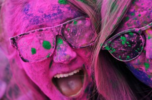 two young women covered in colored paint